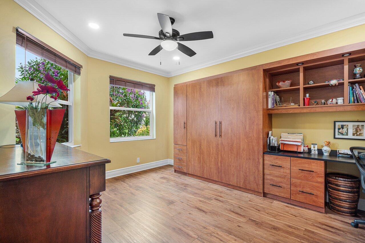 6052 Terra Mere Circle Boynton Beach, FL 33437 - Photo 30 of 52 a view of workspace with wooden floor and ceiling fan