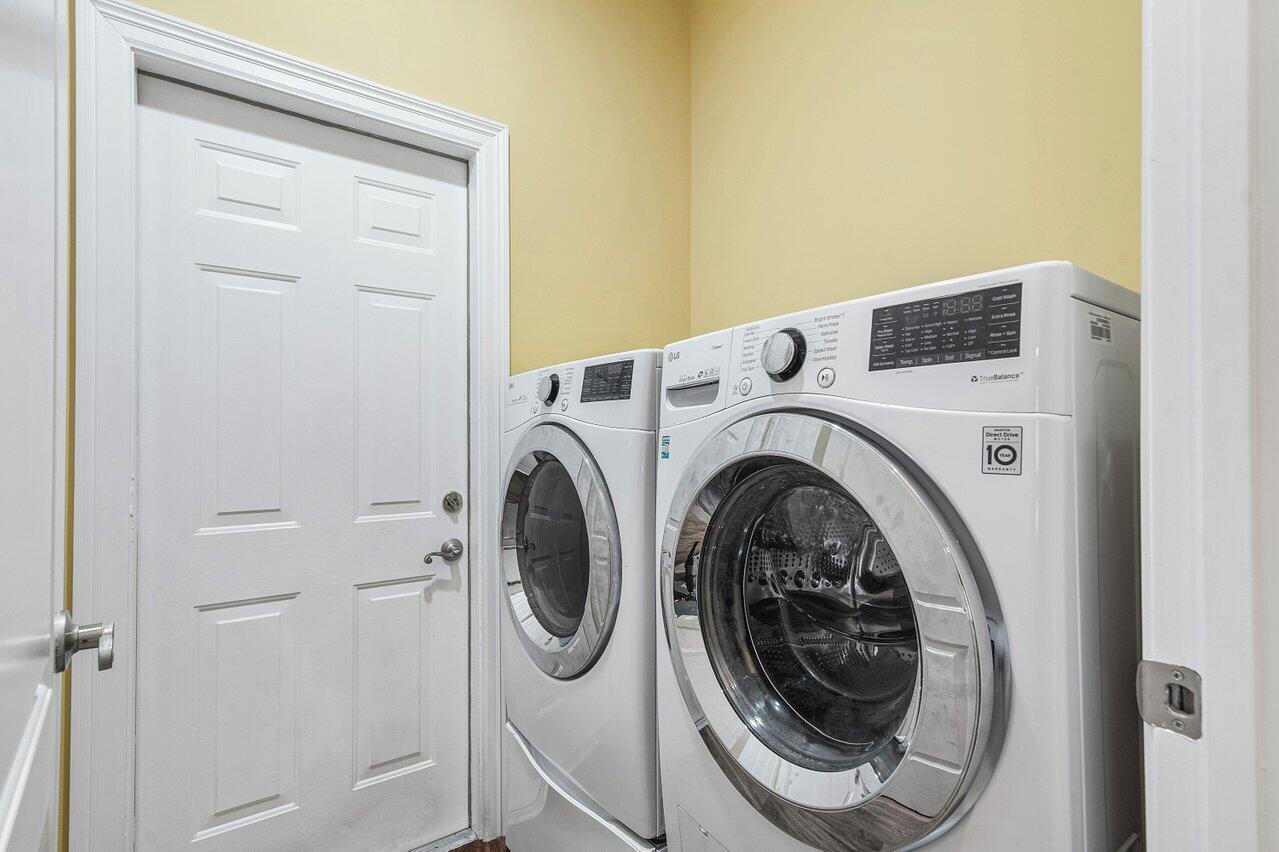 6052 Terra Mere Circle Boynton Beach, FL 33437 - Photo 33 of 52 a utility room with dryer and washer