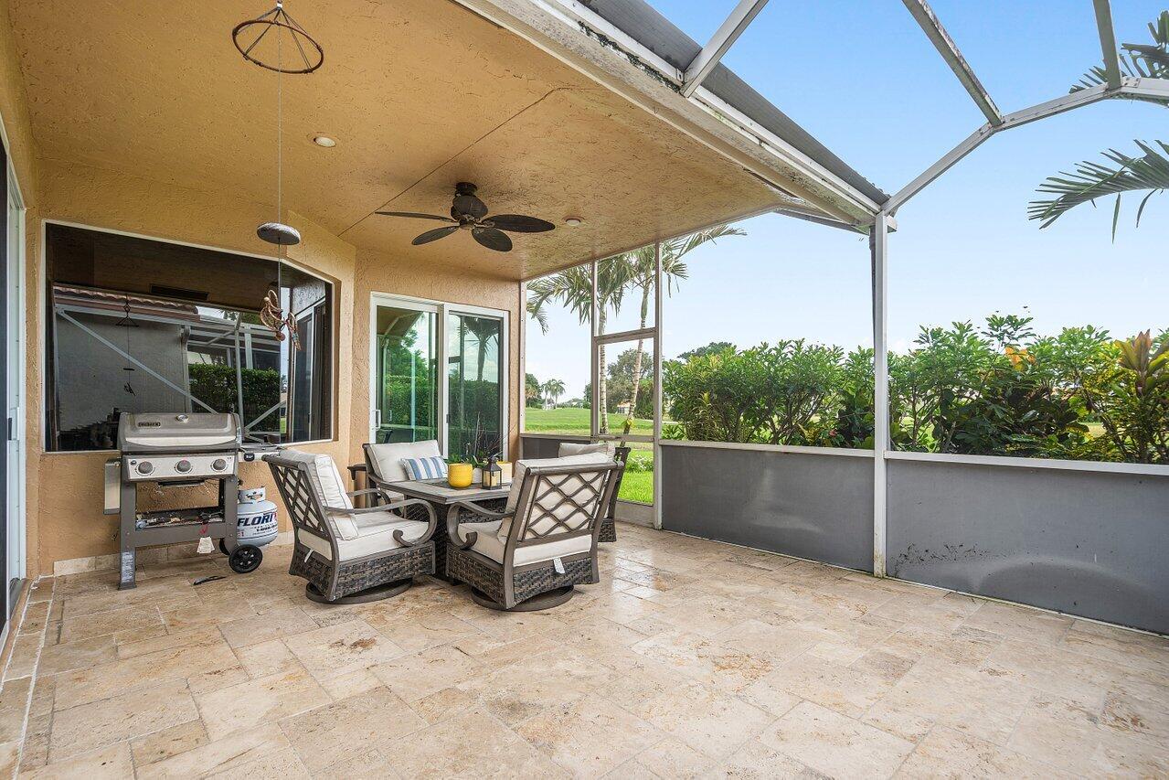 6052 Terra Mere Circle Boynton Beach, FL 33437 - Photo 35 of 52 a view of a terrace with couches and pool