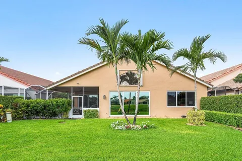 a front view of a house with garden and porch