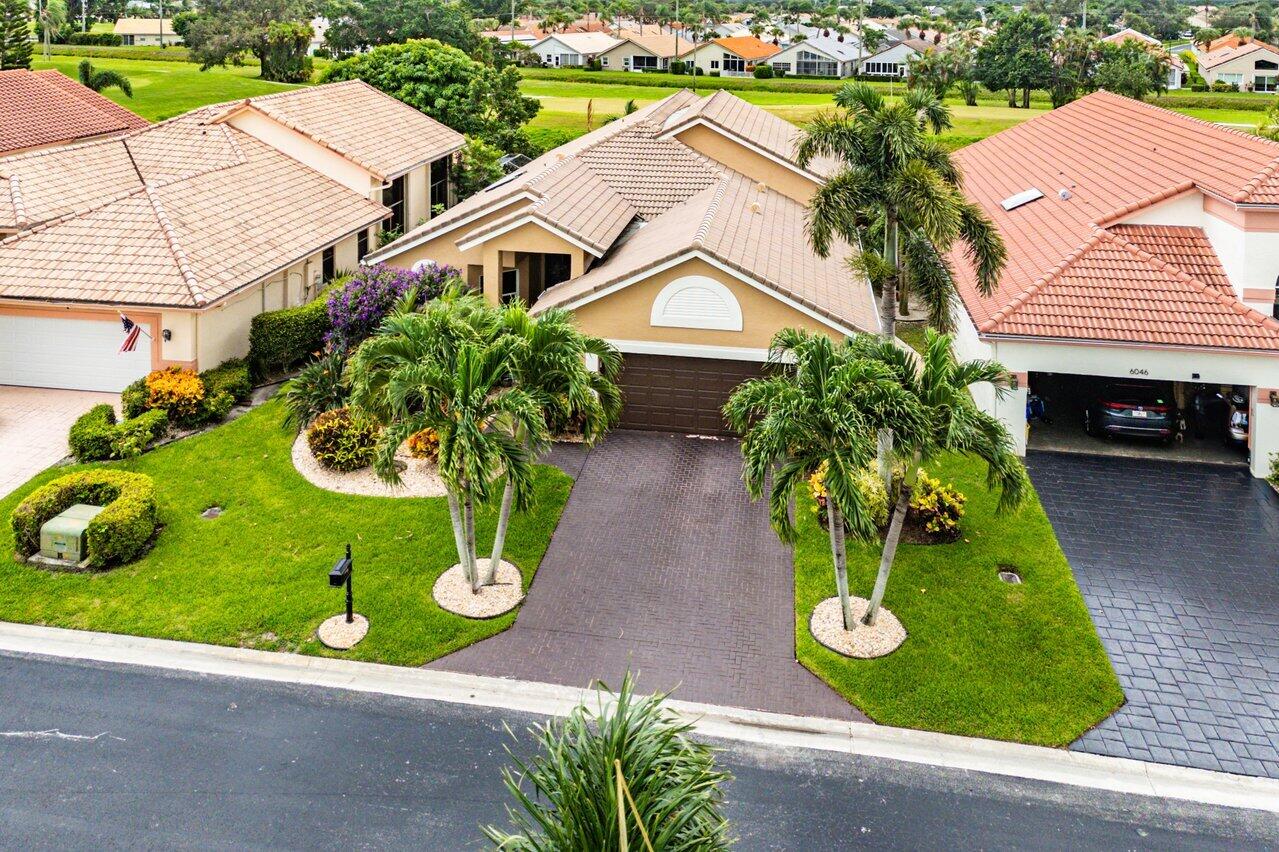 6052 Terra Mere Circle Boynton Beach, FL 33437 - Photo 43 of 52 an aerial view of a house with garden