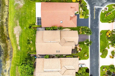 a aerial view of a house with a big yard