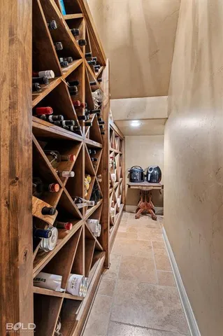 a view of walk in closet with clothes