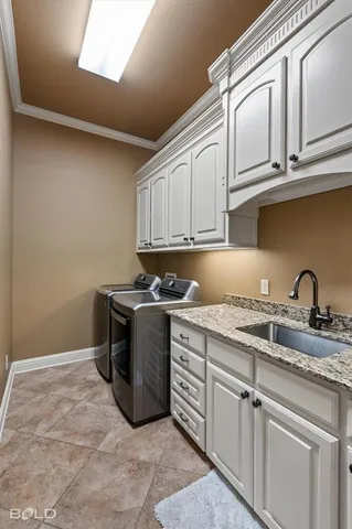 a kitchen with stainless steel appliances granite countertop a sink and cabinets with granite countertops
