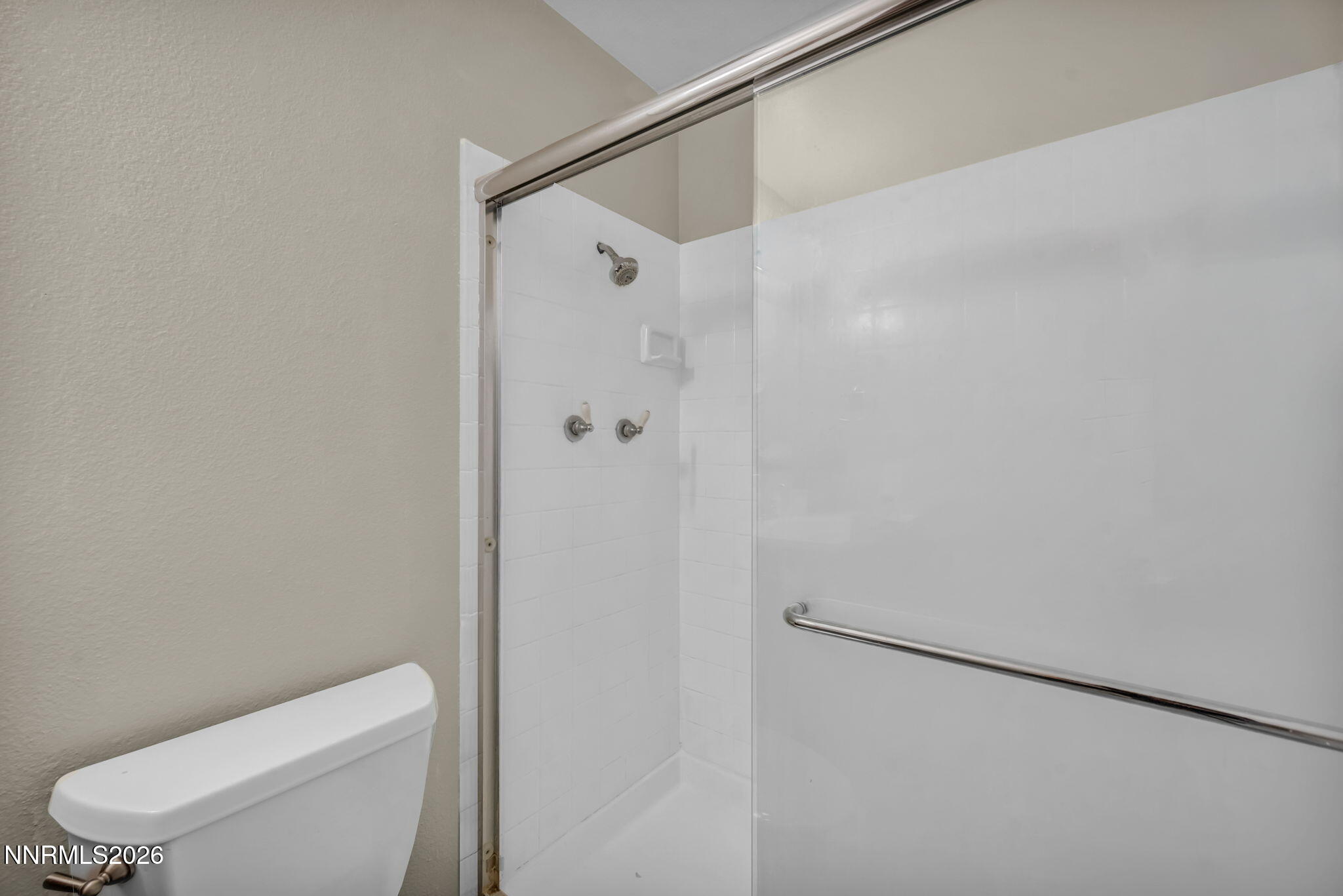 19 Condor Circle Carson City, NV 89701 - Photo 23 of 41 a white toilet sitting next to a shower
