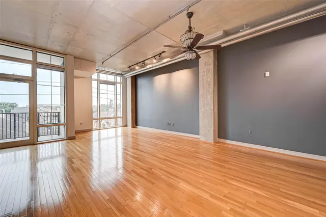 a view of an empty room and wooden floor