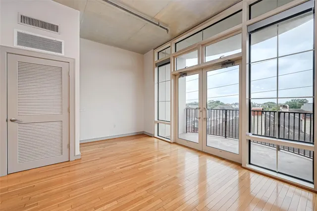 a view of a room with wooden floor