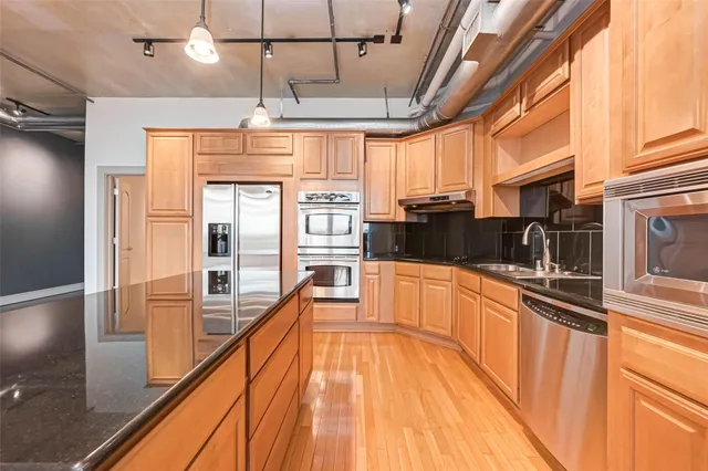 a kitchen with counter top space and appliances