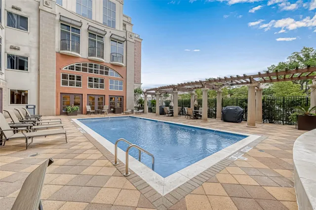 a view of a swimming pool with chairs