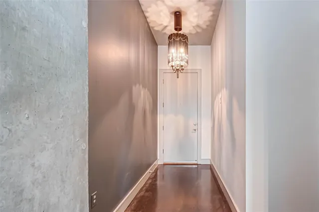 a large kitchen with cabinets wooden floor and a ceiling fan