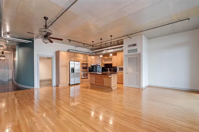 a view of hallway with wooden floor