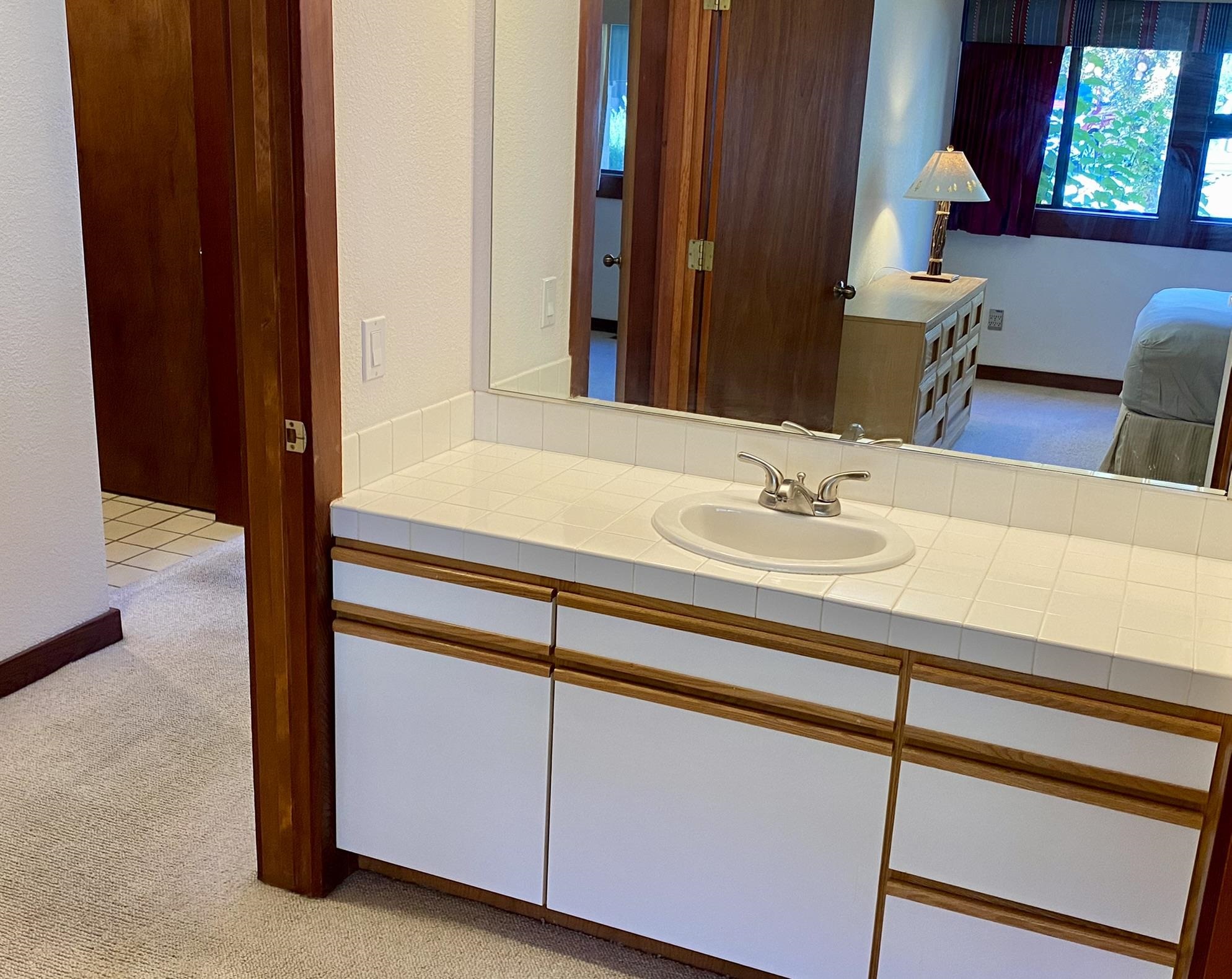 1591 Olympic Vly Road, Unit 28 Olympic Valley, CA 96146 - Photo 11 of 18 a bathroom with a sink and a mirror