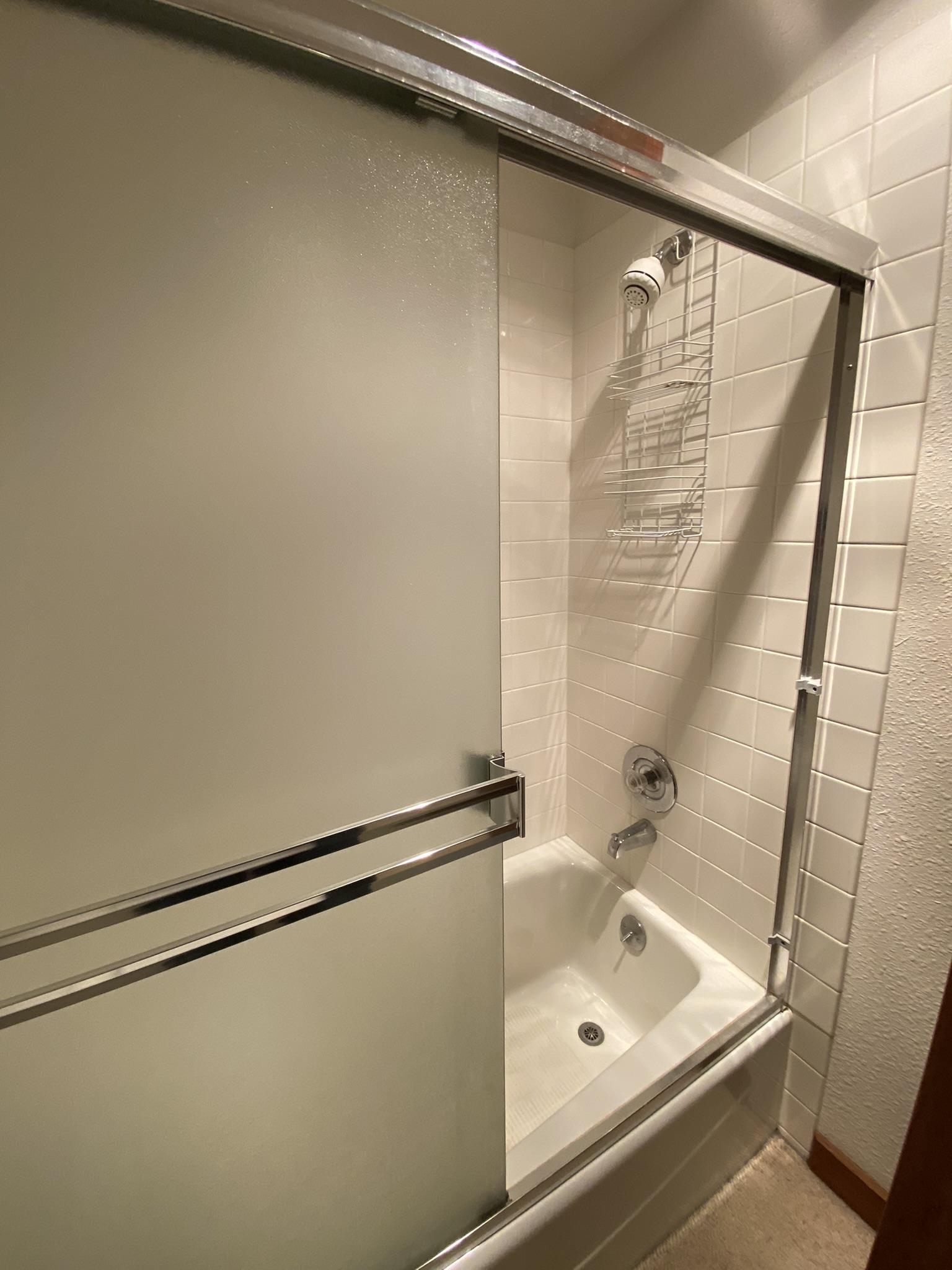1591 Olympic Vly Road, Unit 28 Olympic Valley, CA 96146 - Photo 12 of 18 a bathroom with a tub and a shower