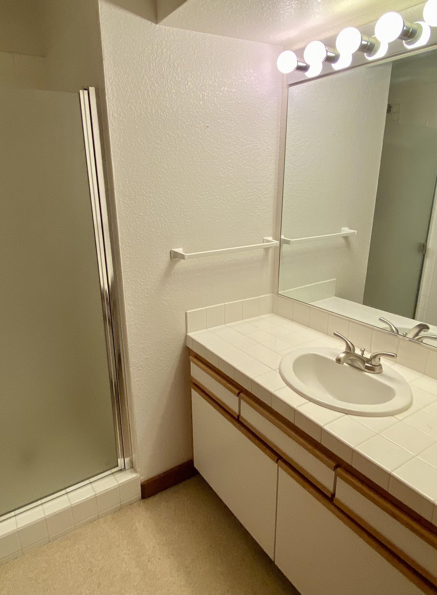 1591 Olympic Vly Road, Unit 28 Olympic Valley, CA 96146 - Photo 14 of 18 a bathroom with a sink and mirror