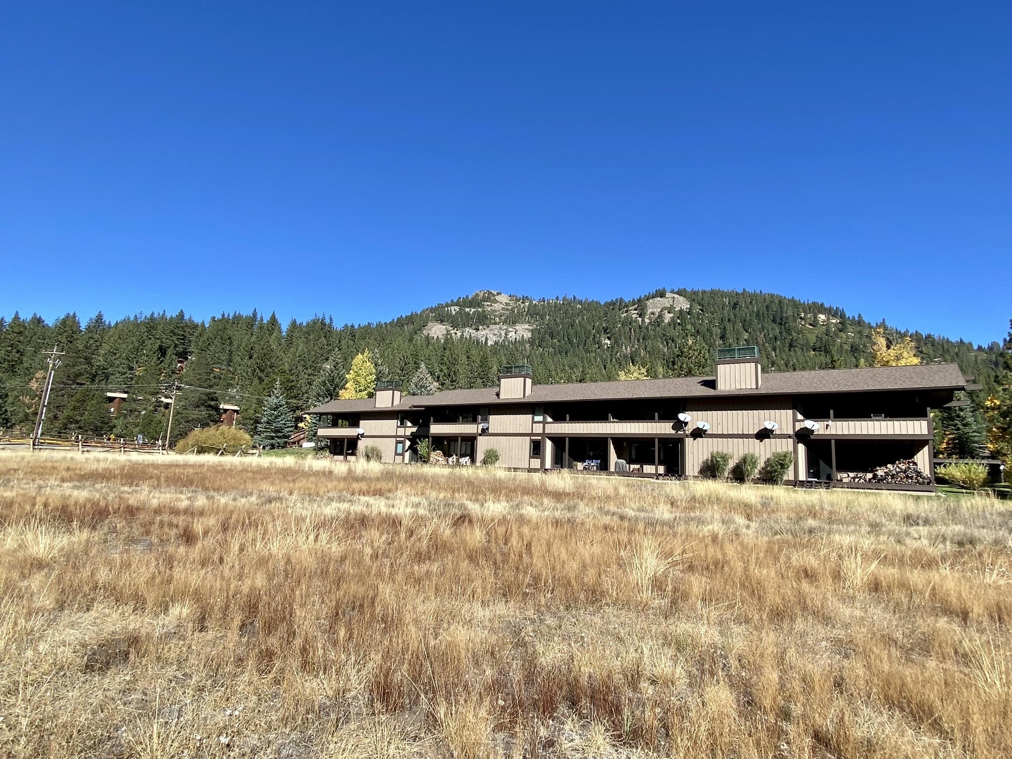 1591 Olympic Vly Road, Unit 28 Olympic Valley, CA 96146 - Photo 17 of 18 a view of a house with a yard and sitting area