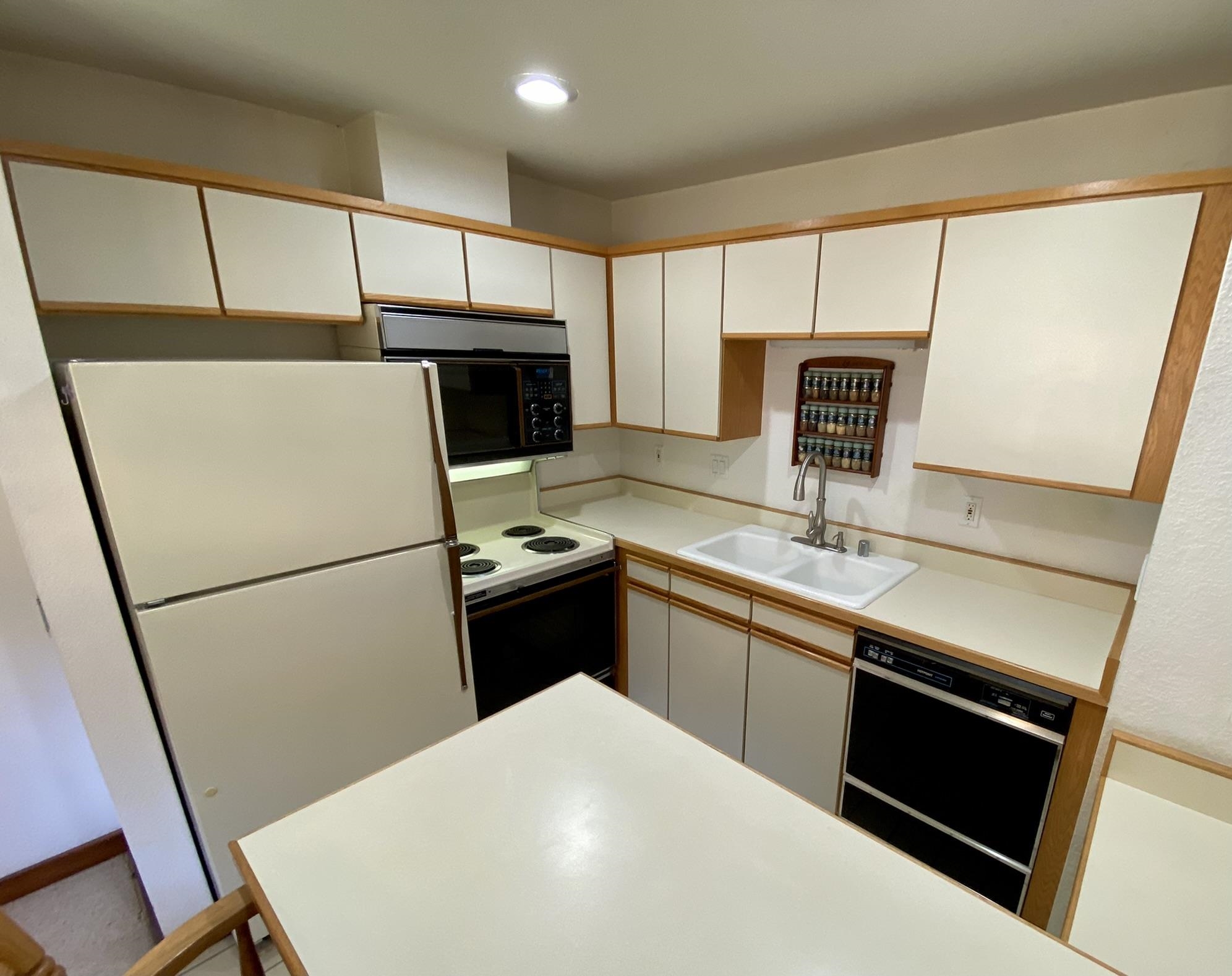 1591 Olympic Vly Road, Unit 28 Olympic Valley, CA 96146 - Photo 5 of 18 a kitchen with a sink a stove and a refrigerator