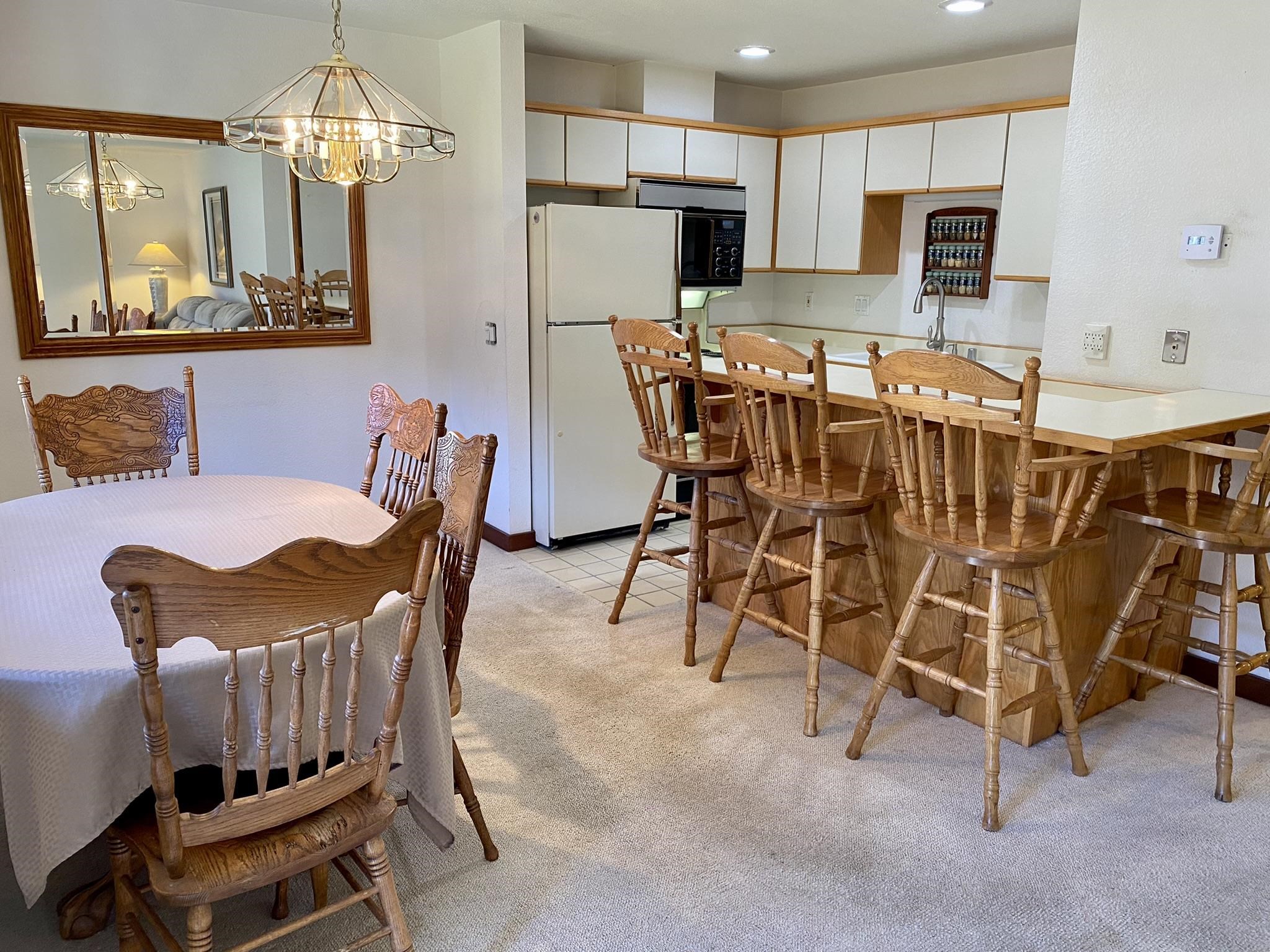 1591 Olympic Vly Road, Unit 28 Olympic Valley, CA 96146 - Photo 6 of 18 a view of a dining room with furniture and chandelier