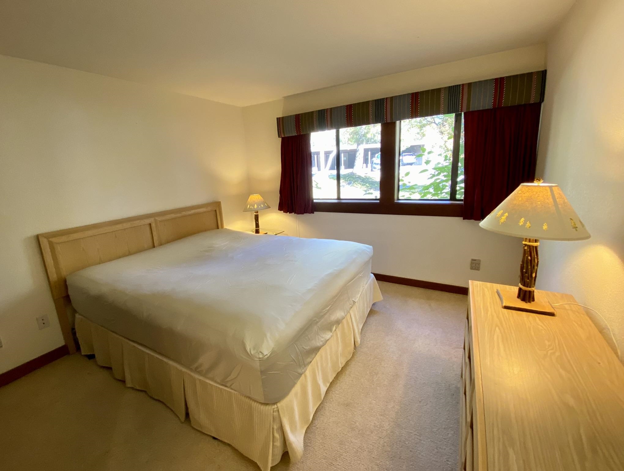 1591 Olympic Vly Road, Unit 28 Olympic Valley, CA 96146 - Photo 9 of 18 a bedroom with a bed and wooden floor