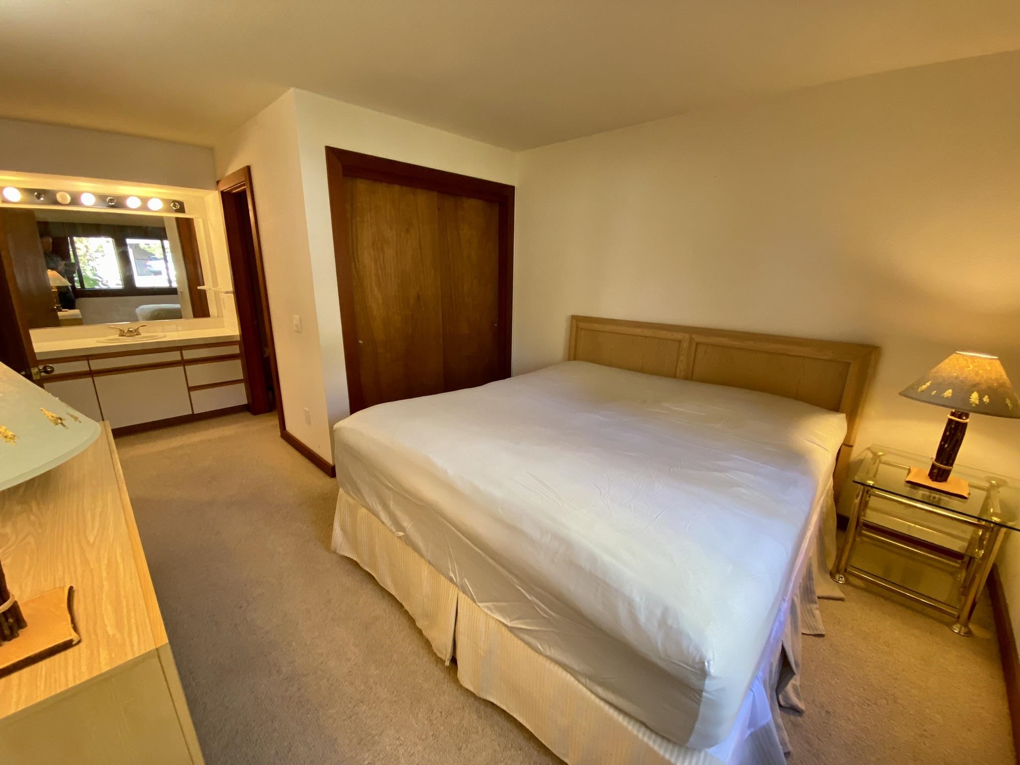 1591 Olympic Vly Road, Unit 28 Olympic Valley, CA 96146 - Photo 10 of 18 a bedroom with a bed and dresser