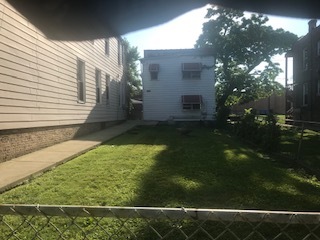 a view of backyard with green space