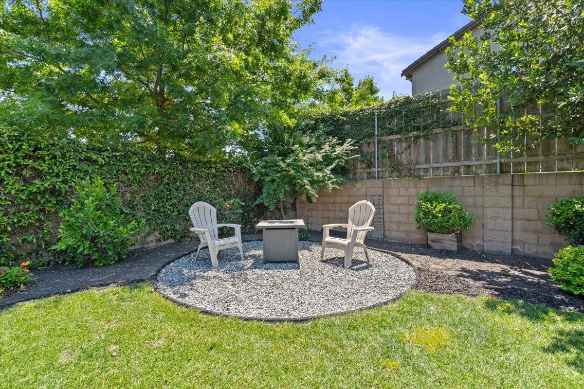 437 Silver Ridge Court Oakdale, CA 95361 - Photo 31 of 41 a backyard of a house with yard and outdoor seating