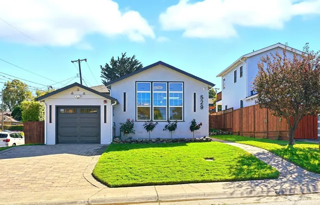 front view of a house with a yard