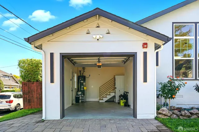 a view of a hallway with potted plants