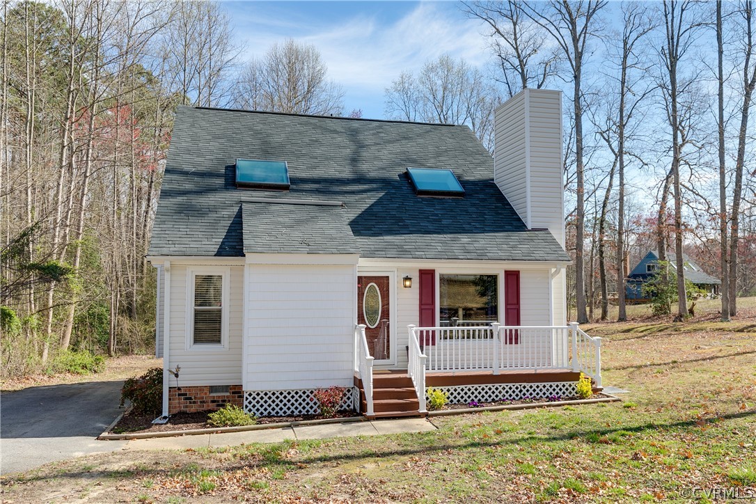 13835 Happy Hill Road Chester, VA 23831 - Photo 1 of 35 a front view of a house with garden