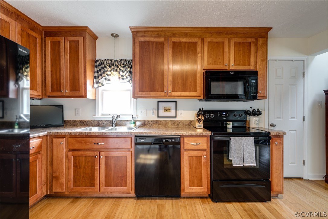 13835 Happy Hill Road Chester, VA 23831 - Photo 14 of 35 a kitchen with stainless steel appliances granite countertop a stove a sink and a microwave