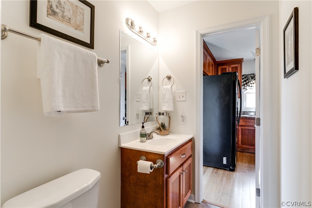 13835 Happy Hill Road Chester, VA 23831 - Photo 18 of 35 a bathroom with a sink vanity mirror and toilet
