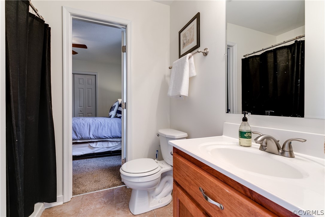 13835 Happy Hill Road Chester, VA 23831 - Photo 19 of 35 a bathroom with a toilet sink and mirror