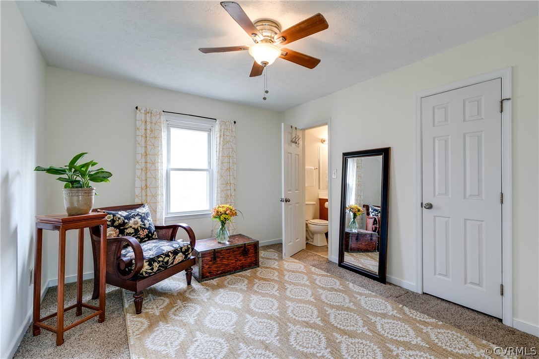 13835 Happy Hill Road Chester, VA 23831 - Photo 23 of 35 a living room with furniture and a window
