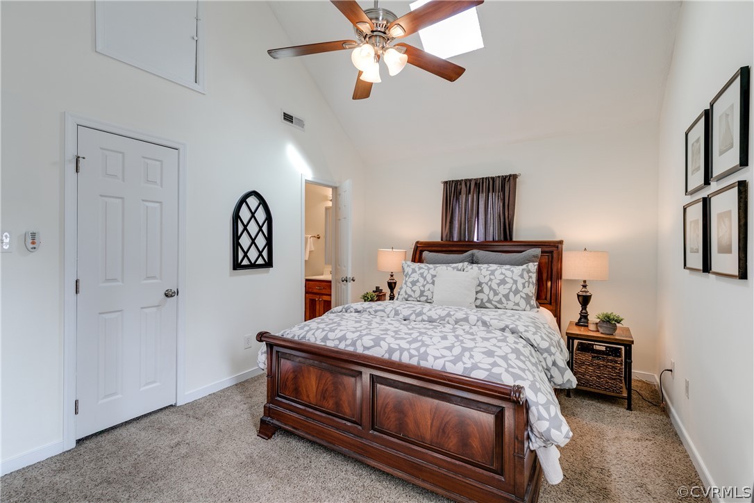 13835 Happy Hill Road Chester, VA 23831 - Photo 25 of 35 a bedroom with a bed and a chandelier