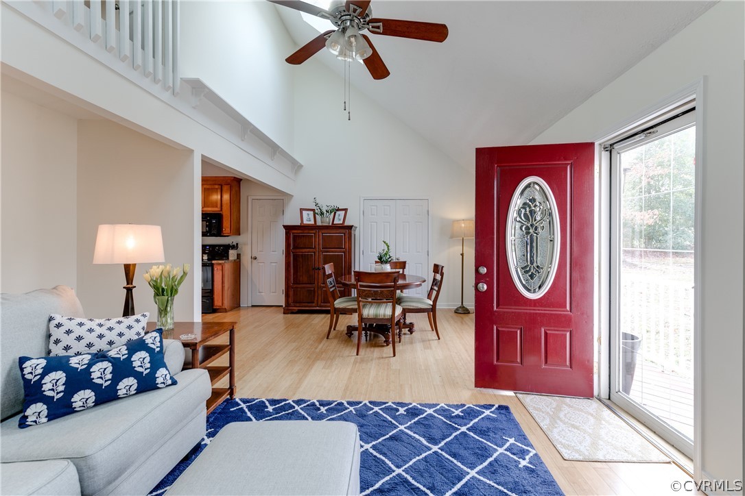 13835 Happy Hill Road Chester, VA 23831 - Photo 5 of 35 a living room with furniture a chandelier and a window