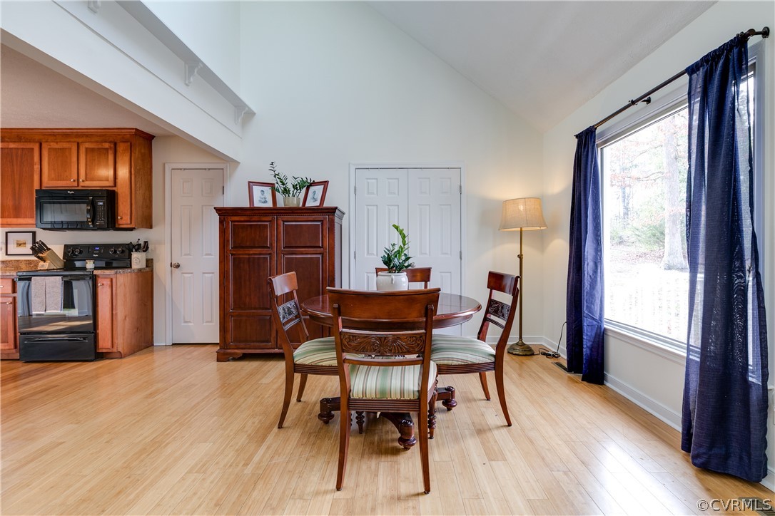 13835 Happy Hill Road Chester, VA 23831 - Photo 9 of 35 a dining room with furniture and wooden floor