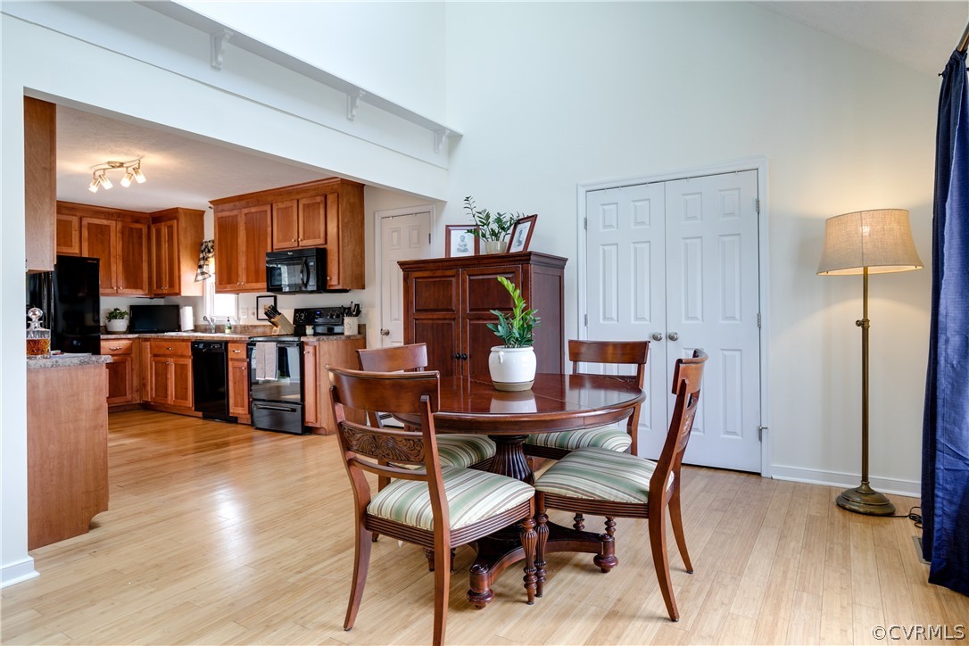 13835 Happy Hill Road Chester, VA 23831 - Photo 10 of 35 a view of a dining room with furniture and wooden floor
