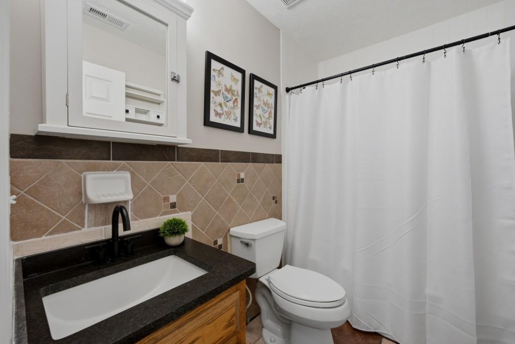 542 Knox Chapel Road Social Circle, GA 30025 - Photo 13 of 52 a bathroom with a sink a toilet and a mirror