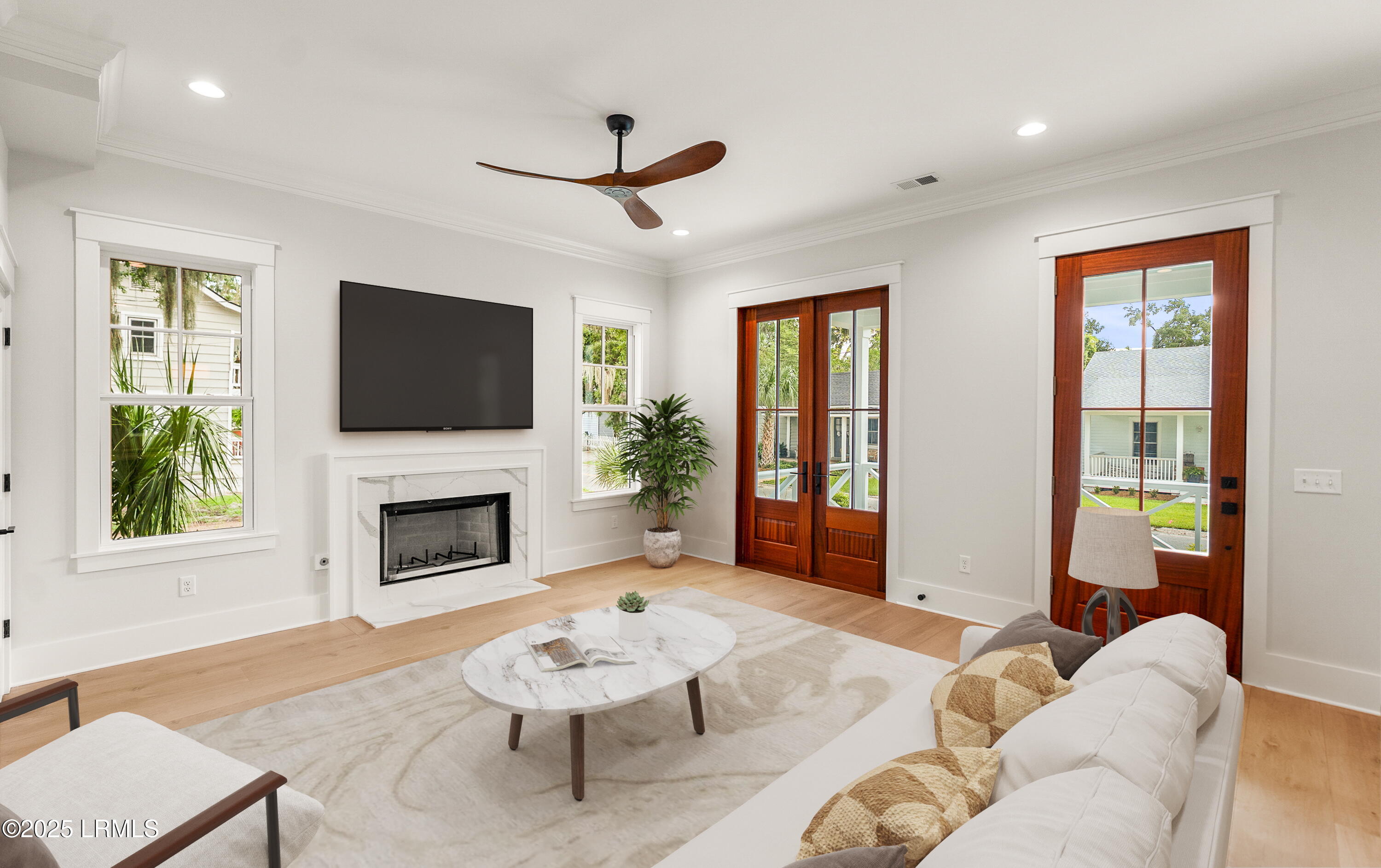 902 Harrington Street Beaufort, SC 29902 - Photo 9 of 35 LIVING ROOM TV ON WALL OVER FIRE PLACE