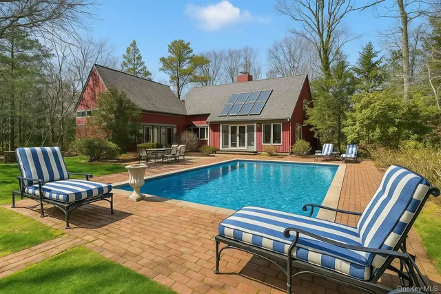 a view of a patio with chairs and a table