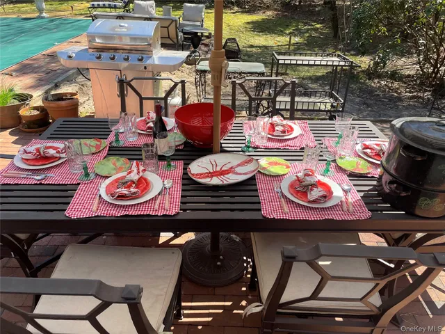 a table tennis table and chairs in a patio