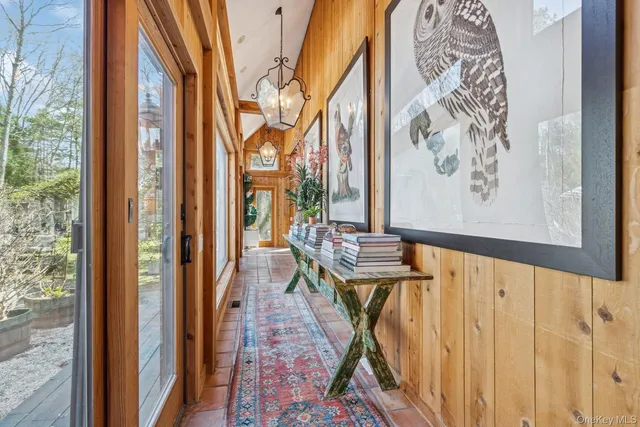 a view of an entryway with wooden floor