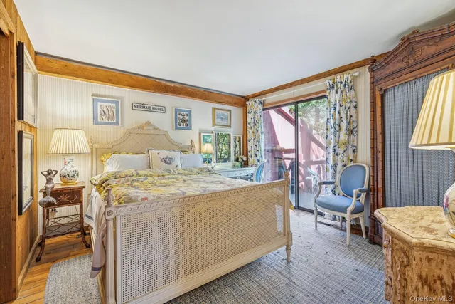 a bedroom with a bed and a dresser in it