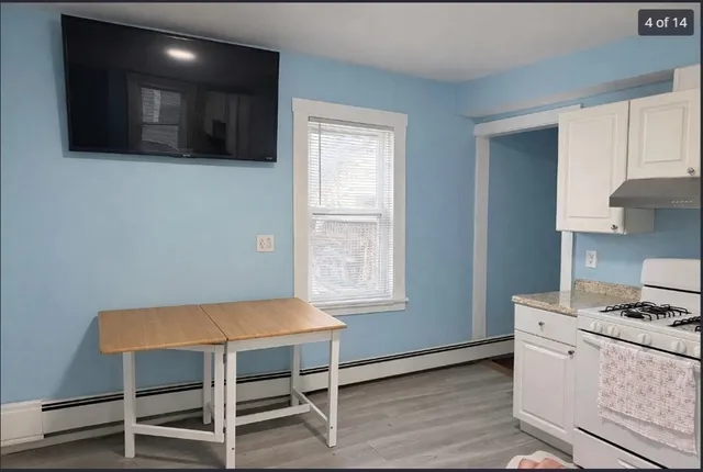 a kitchen with a table and chairs in it