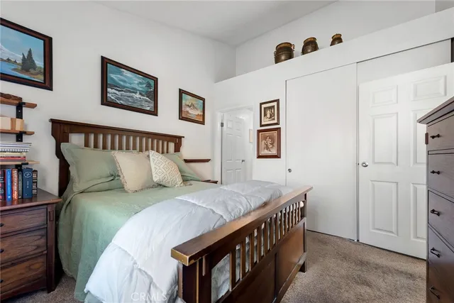 a bedroom with a bed and a furniture