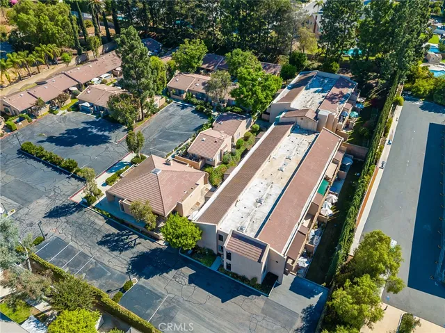 an aerial view of a residential houses with outdoor space