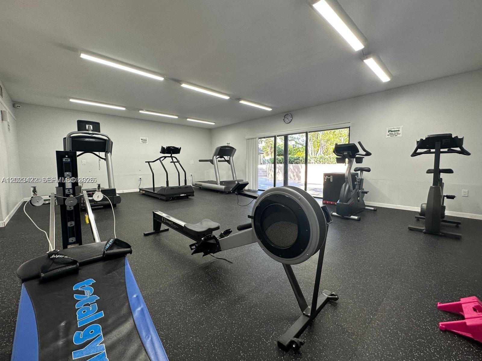 605 Ives Dairy Road, Unit 3067 Miami, FL 33179 - Photo 4 of 28 a view of a room with gym equipment
