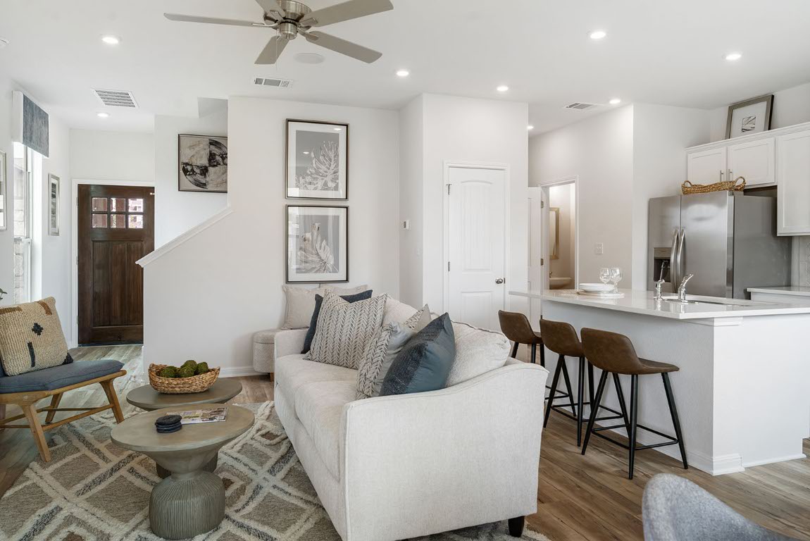 20604 A Haygrazer Way Pflugerville, TX 78660 - Photo 12 of 31 a living room with furniture and a wooden floor
