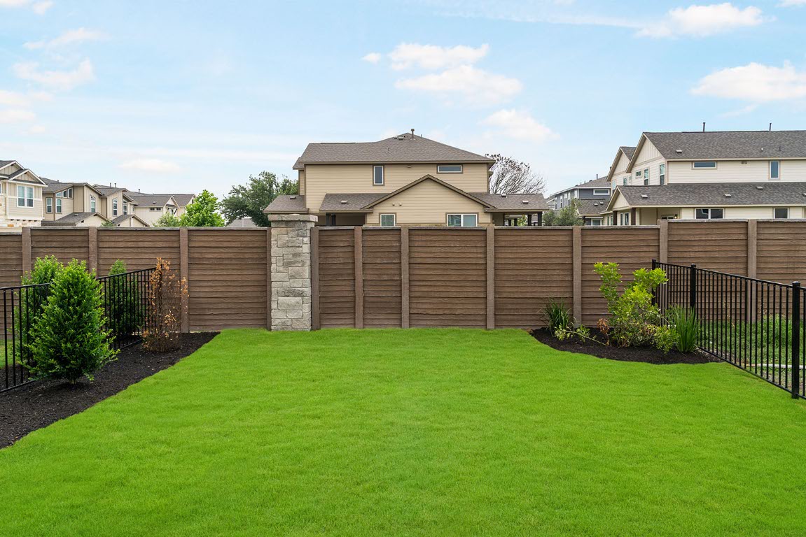 20604 A Haygrazer Way Pflugerville, TX 78660 - Photo 30 of 31 a view of a yard with brick house and wooden fence