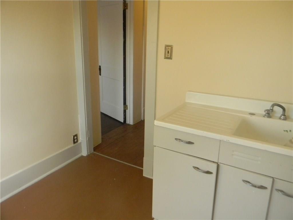 786 Montclair Street Greenfield, PA 15217 - Photo 12 of 21 Den or possible laundry room. Sink is not working but at one time was most likely an upstairs kitchen.