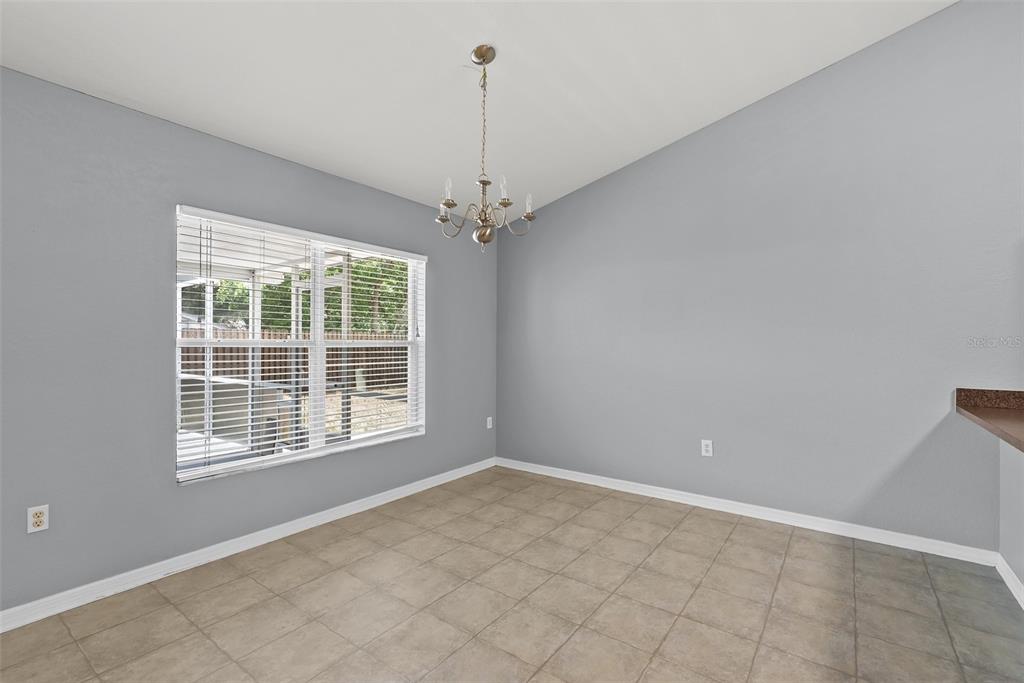 11366 Riddle Drive Spring Hill, FL 34609 - Photo 14 of 49 a view of an empty room with a window